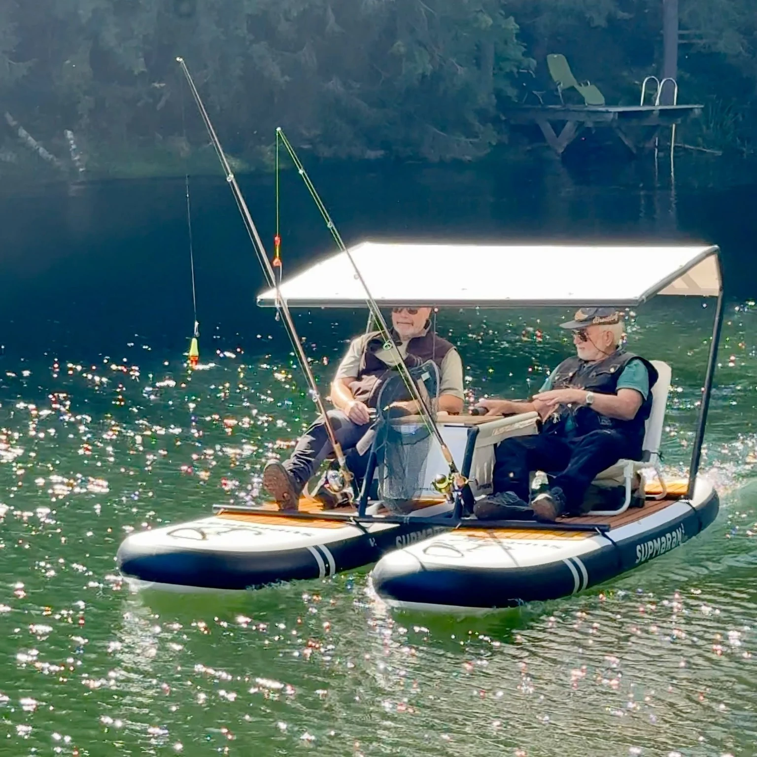 Two anglers fishing from a Supmaran under its canopy